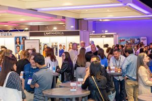 Crowd of people in vendor hall.