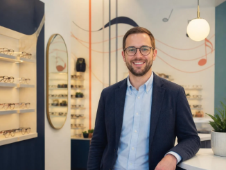 Male optometrist smiling in practice.